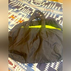 Oversized Urban Outfitters Nylon Crescent Bag with neon lining flight jacket bag